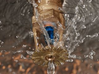 Technicians performing water extraction in a flooded Downey residence.